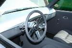 custom one-off steering wheel carried over from the original build- spokes match those found on the rims